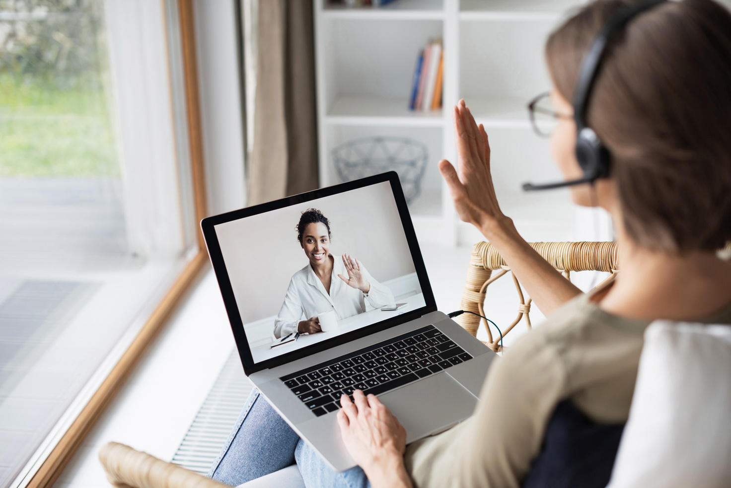 Video conferencing. Woman wearing headset have meeting online